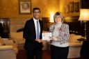 Maria Caulfield, with Prime Minister Rishi Sunak and the winning Christmas card design