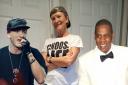 Jill Clark says rappers such as Eminem, left, and Jay-Z, right, have inspired her to rap for a good cause