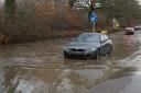 Cars drove through deep flood water in Hellingly
