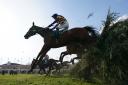 Corach Rambler ridden by Derek Fox clears a fence on the way to winning the Randox Grand National Handicap Chase during day three of the Randox Grand National Festival at Aintree