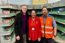 Peter Kyle with two staff members at the Hove sorting office