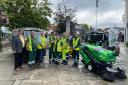 Councillor Jay Mercer, far left, and refuse workers unveil the new fleet of electric sweepers