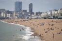 Dozens of people bared all and soaked up the sunshine on Brighton's naturist beach