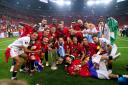 Sevilla players pose for a photo with the UEFA Europa League trophy after beating Roma in the final. Image: PA