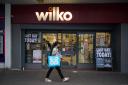 It is the last day at Wilko in Horsham. Image shows a person passes the Wilko store in Barking, east London, on the final day of its trading