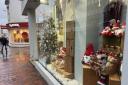 Festive decorations and even Christmas trees have started appearing in shop windows