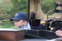 Ben behind a locomotive on the Evesham Vale Light Railway aged five
