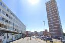 A woman has died after falling from some flats in Queensway, Bognor
