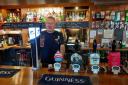 Peter Wilson behind the bar at the Hare and Hounds