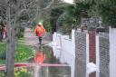 Flood teams have battled to protect homes after heavy rain struck Sussex