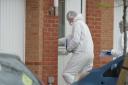 Neighbours shocked as woman dies and man arrested for murder in quiet street