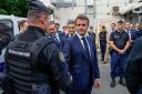 French President Emmanuel Macron visits the central police station in Noumea, New Caledonia (Ludovic Marin/AP)