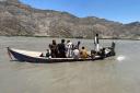 Rescuers search for survivors of the sunken boat, in the Mohmand Dara district of Nangarhar (AP Photo)