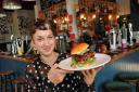 Greta Lindsay, manager of The Gladstone, with The Blue Burger