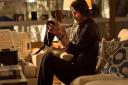 Daisy the Dog (Andy) and John Wick (Keanu Reeves) share a moment...
