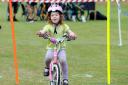A child cycling at this year's Bikestock in Brighton.