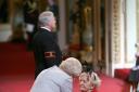 Marguerite Patten being made a CBE by Queen Elizabeth II at Buckingham Palace in 2010. Picture: Lewis Whyld/PA Wire
