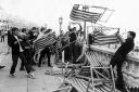 Mods pictured in May 1964 throwing deckchairs from the roof terrace of Brighton Aquarium on to Madeira Drive below