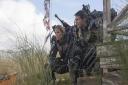 Emily Blunt and Tom Cruise perch near the Edge Of Tomorrow...