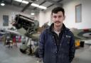 Alex Monk, Spitfire pilot and engineer at the Biggin Hill Heritage Hangar, with a Spitfire which is currently undergoing a full restoration at the airport in Kent (Gareth Fuller/PA Wire)
