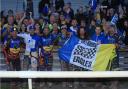 Eastbourne riders celebrate with fans after the win at Newcastle. Picture Mike Hinves