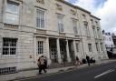 A carer defrauded an elderly man of more than £150,000, a court has decided. Pictured is Lewes Crown Court
