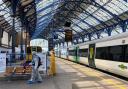 A teenager was punched and threatened with a knife in Brighton rail station