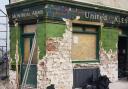The distinctive green tiles of the pub were destroyed by builders last month