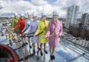 Staff at the i360 donned masks of the Queen and climbed on top of the attraction's glass pod while high above the city