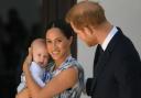 Prince Harry and Meghan Markle with their daughter Lilibet
