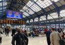 Commuters, like these at Brighton Station this morning, face another day of disruption amid continuing industrial action