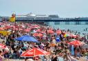 Thousands gathered on Brighton beach as temperatures soared across the Sussex coast