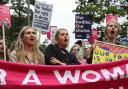 Demonstrators gathered outside the United States embassy in Vauxhall to protest against the decision to scrap constitutional right to abortion