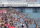 Thousands packed Brighton beach as the city baked in its hottest day on record