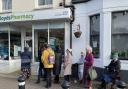 Queues of customers looking for prescriptions outside LloydsPharmacy in Henfield
