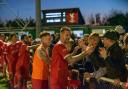 Rob O'Toole leads Whitehawk players as they celebrate with fans