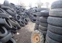 Environment crime officers discovered surplus tyres piled high at the site in Chichester