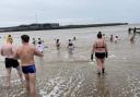 Swimmers braved cold conditions to take a dip in the sea on the morning of New Year's Day