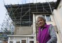 Jill Wilson wants a reduction in her council tax after living underneath scaffolding that has remained largely untouched for ten years