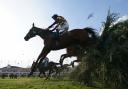 Corach Rambler ridden by Derek Fox clears a fence on the way to winning the Randox Grand National Handicap Chase during day three of the Randox Grand National Festival at Aintree