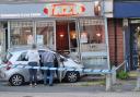 A car crashed into an Indian restaurant in Burgess Hill on Monday