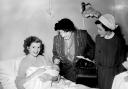Dorothy Stringer, the Mayor of Brighton, visiting a new mum at the Royal Sussex County Hospital in Brighton in 1953
