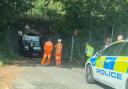 Live: Van stuck under railway bridge with 'driver trapped'