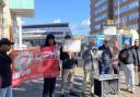 Protesters gathered near Uber's offices in Hove demanding fair pay for their work
