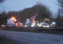 A section of the A27 is closed after a truck rolled into a ditch