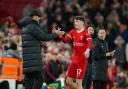 Lewis Koumas, pictured being congratulated by Jurgen Klopp after scoring on his Liverpool debut in February, is in line to win his first Wales cap next week (Peter Byrne/PA)
