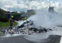 Road closed as firefighters tackle blaze