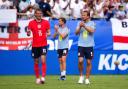 England's Dan Burn, Jordan Henderson and Harry Kane applaud the fans following the friendly against New Zealand