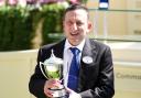 Tony Bloom with the trophy after seeing Venetian Sun win The Commonwealth Cup