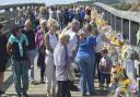 Thousands of bunches of flowers have been left on the Shoreham Tollbridge.  Picture: Terry Applin